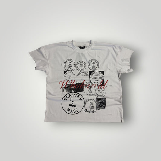 WholeWrldArchives white cotton t-shirt with black vintage Massachusetts postmark stamp graphics and raw-edge sleeves.